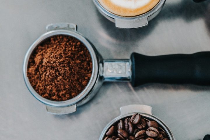 flat lay photography of coffee latte, ground coffee, and coffee beans