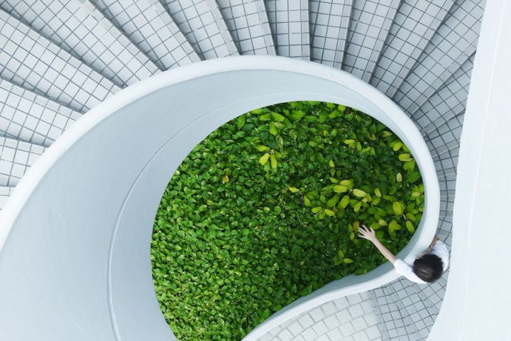 woman standing spiral stairs