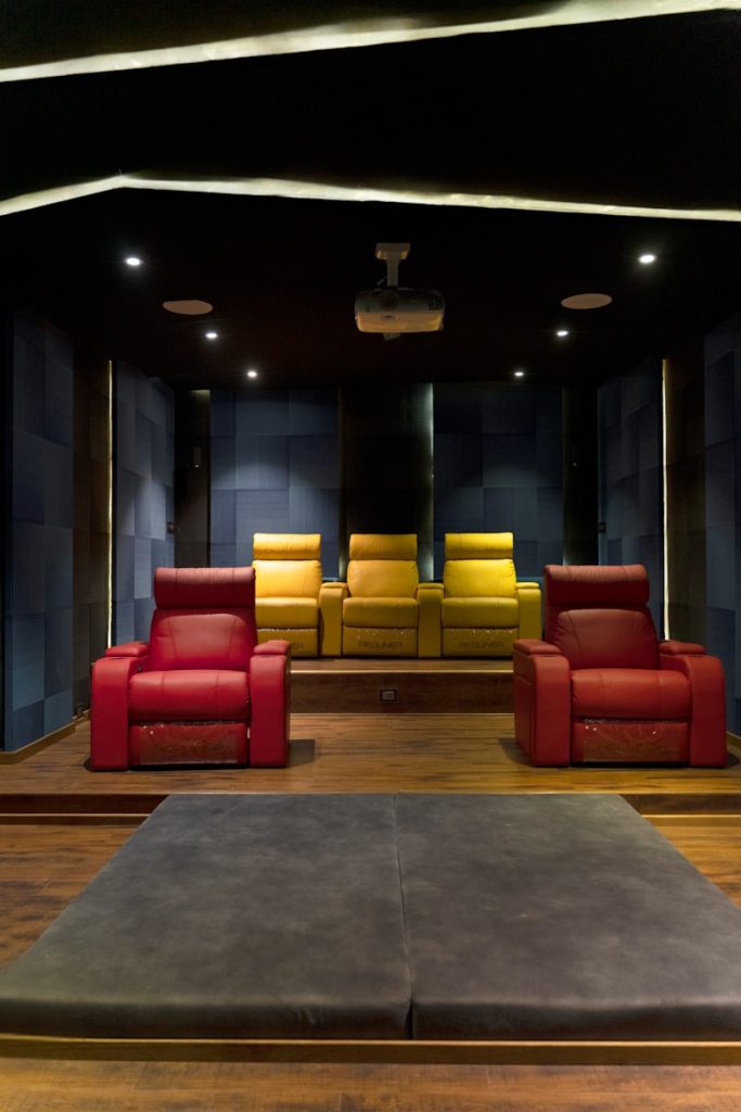 A luxurious home theater room with comfortable seating.