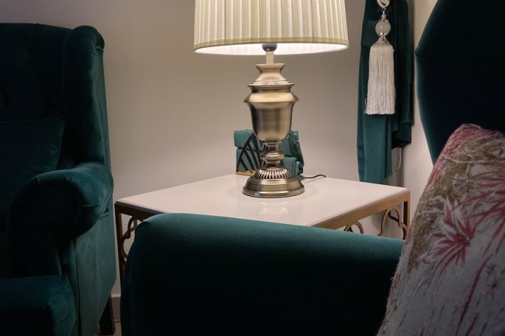 white and gold table lamp on white wooden table