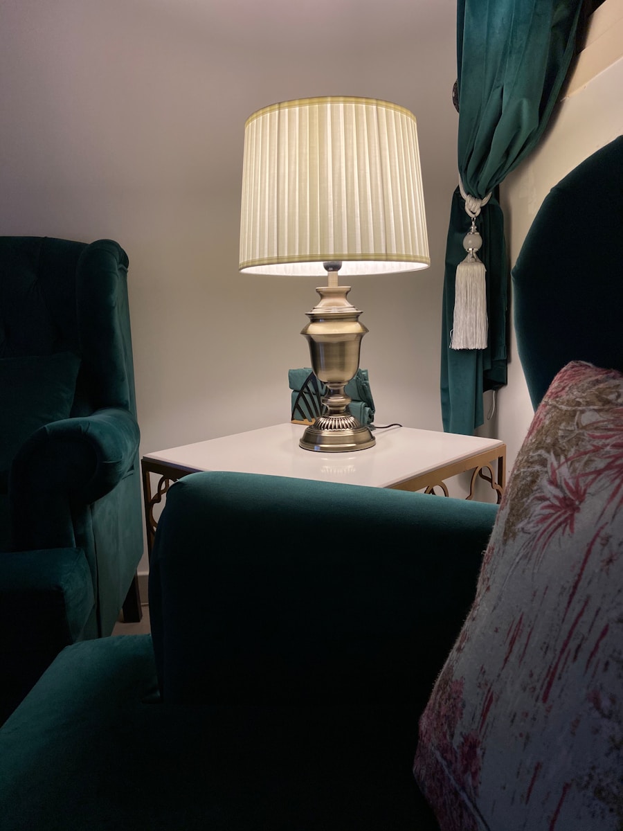 white and gold table lamp on white wooden table